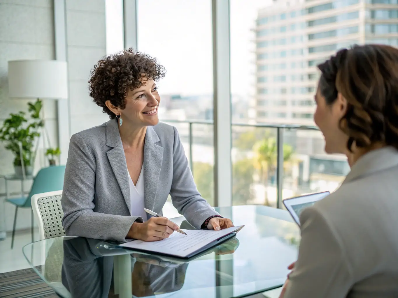 An image of a confident professional receiving personalized coaching in a modern office setting, symbolizing career advancement and personal growth.